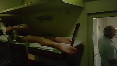 The girl is naked on the train, and people are standing nearby