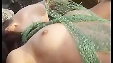Fish woman totally naked outdoors