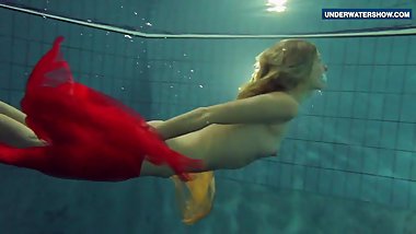 Yellow and Red clothed teen underwater